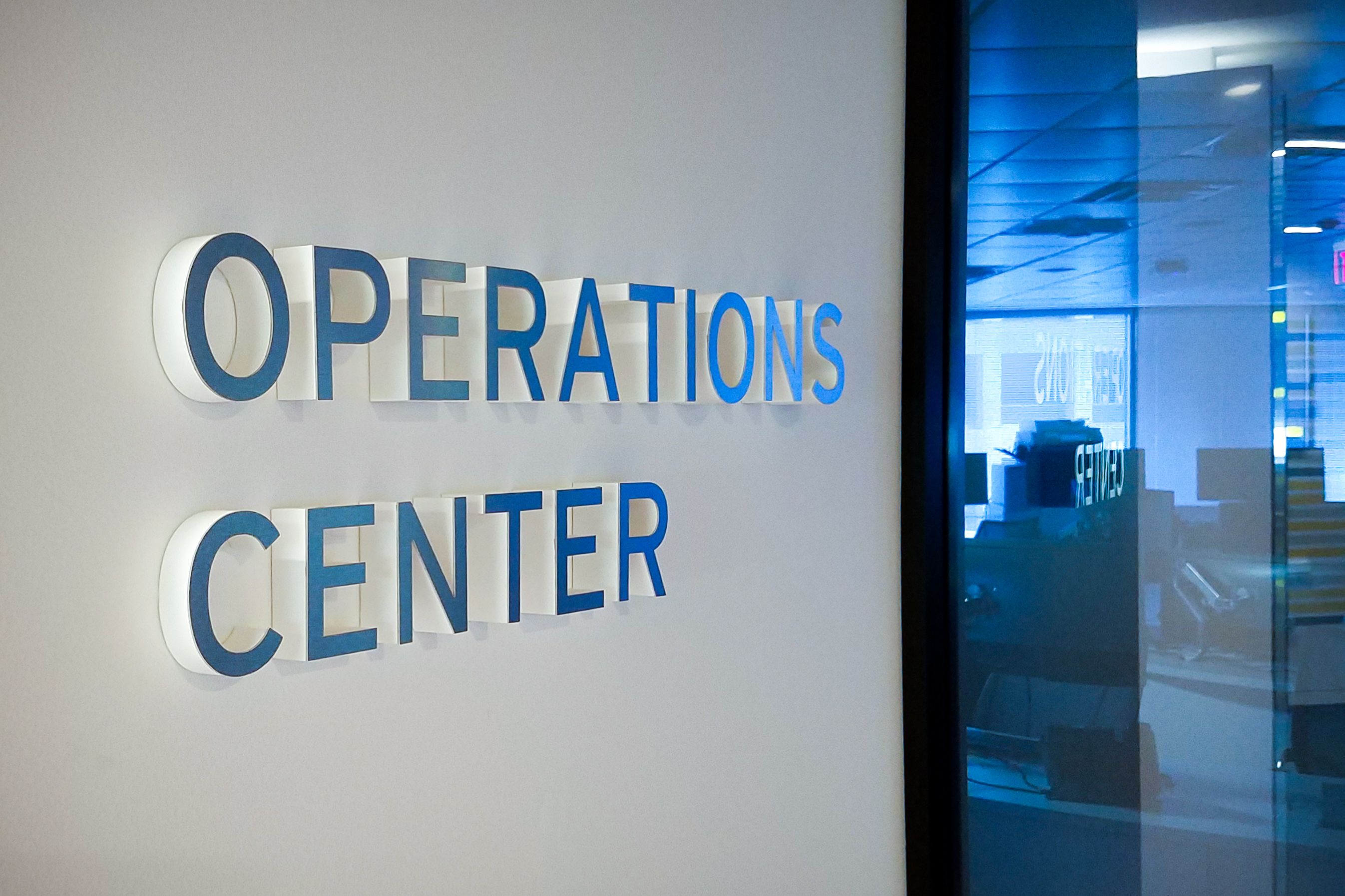 Aluminum-faced, thick foam letters mounted on a wall spell out 'OPERATIONS CENTER'. The letters appear to pop out of the wall due to their depth.